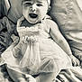 baby, infant, child, smiling, happy, dress, headband, flower, sitting, blanket, cute, portrait, monochrome, black_and_white, feet, hands, face, candid, joyful, tulle