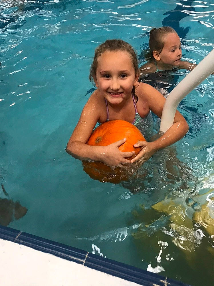 Carina is registered to the contest to win money with this photo: baby_products, bathing, child, fun, games, joy, leisure, leisure_centre, lifejacket, muscle, person, personal_protective_equipment, play, product, recreation, smile, summer, swimmer, swimming, swimming_pool