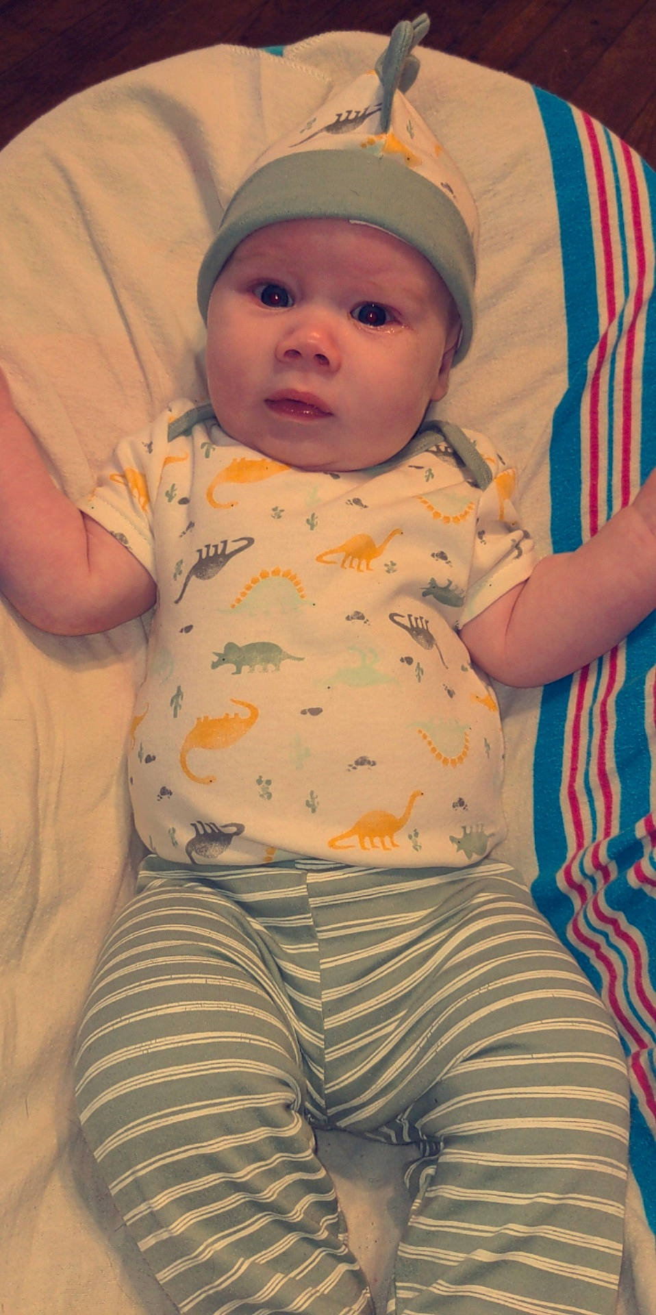 Danny is registered to the contest to win money with this photo: baby, baby_toddler_clothing, cheek, chin, comfort, cool, eye, face, head, headwear, human_body, iris, lip, mouth, nose, orange, person, pink, skin, sleeve