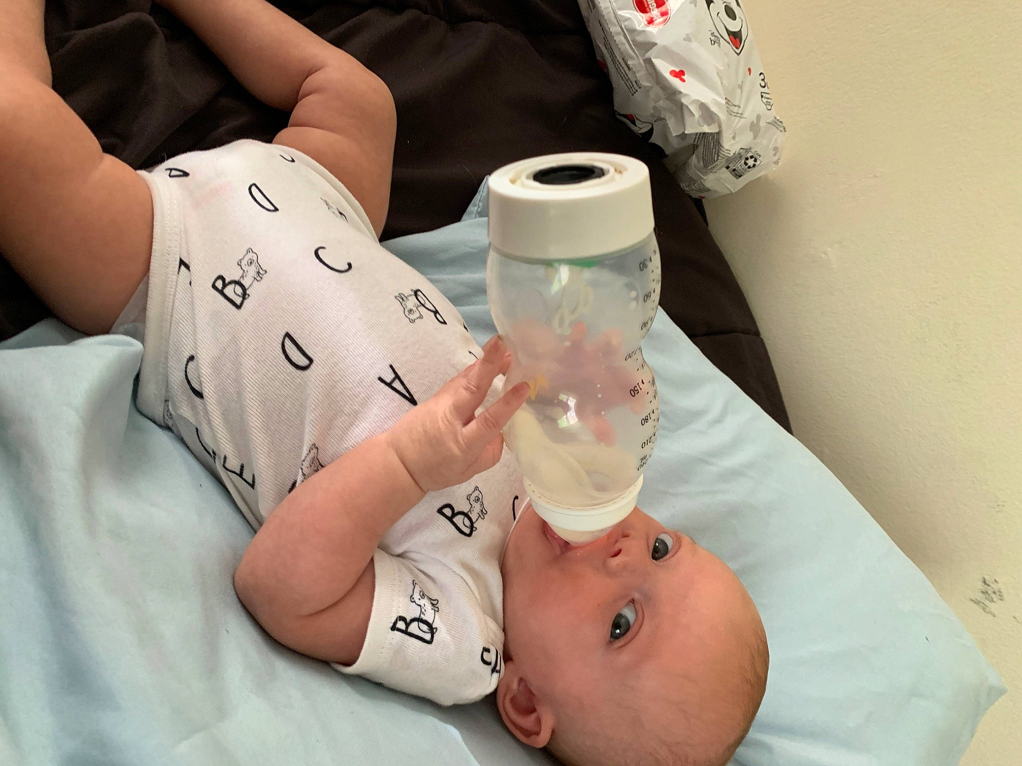 Reighlyn is registered to the contest to win money with this photo: arm, baby, baby_bottle, baby_products, birth, bottle, child, drinkware, foot, hand, leg, nail, nose, person, plastic_bottle, product, skin, tableware, toddler