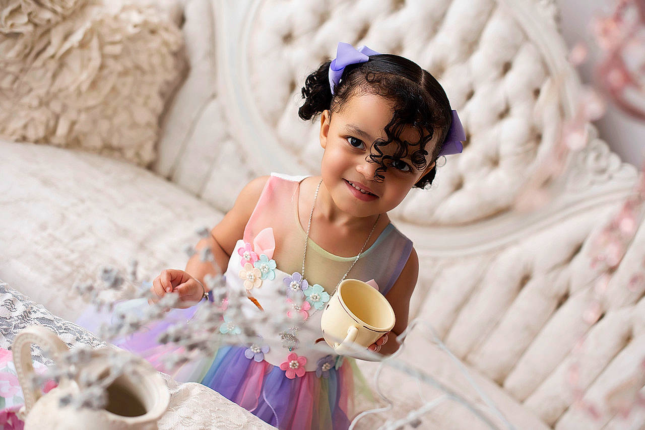 Baylee joined the competition — help win amazing prizes! baby, baby_toddler_clothing, comfort, dress, drinkware, event, eyewear, fashion_accessory, fun, glasses, happy, headpiece, joy, linens, pattern, person, pink, sitting, sweetness, tableware
