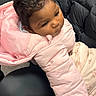 Saryha is registered to the contest to win money with this photo: toddler, child, pink_jacket, blanket, indoor, waiting_room, chair, person, hair, face, clothing, seated, casual, portrait, expression, curly_hair, phone_overlay, sleeve, warm_clothing, soft_texture