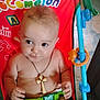 Andrew joined the competition — help win amazing prizes! baby, child, diaper, necklace, cross, drool, green_belt, red_chair, blue_frame, toy, indoor, floor_tiles, cute, chubby, sitting, looking_away, infant, playful, colorful, young