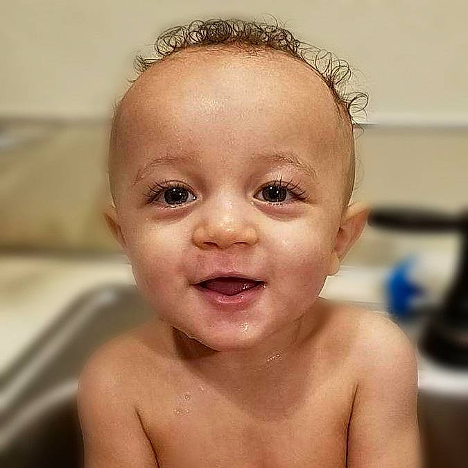 Kyron is registered to the contest to win money with this photo: baby, baby_making_funny_faces, bathing, cheek, child, chin, close_up, eye, eyebrow, face, facial_expression, forehead, hair, hairstyle, head, lip, nose, person, skin, smile