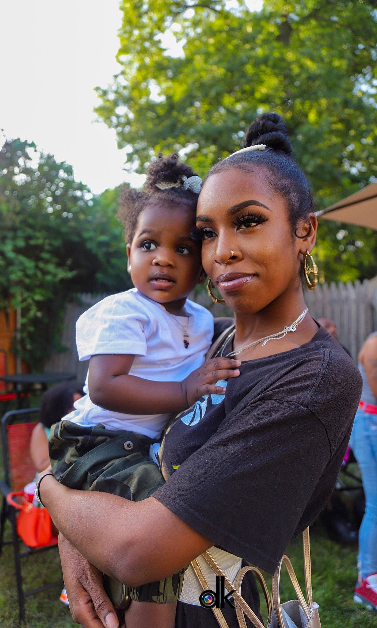 Leilani joined the competition — help win amazing prizes! adaptation, black, chair, child, event, face, fun, grass, hairstyle, happy, human, jewellery, joy, leisure, necklace, person, recreation, shorts, t_shirt, toddler