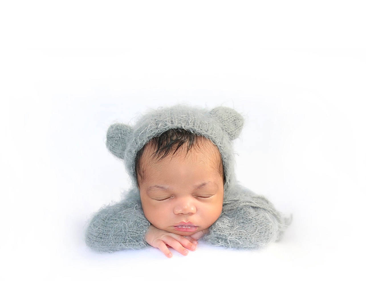 Princeton is registered to the contest to win money with this photo: baby, baby_toddler_clothing, beanie, cap, cheek, comfort, ear, eyelash, fashion_accessory, fur, hair_accessory, happy, headgear, knit_cap, linens, nose, person, toddler, winter, wool