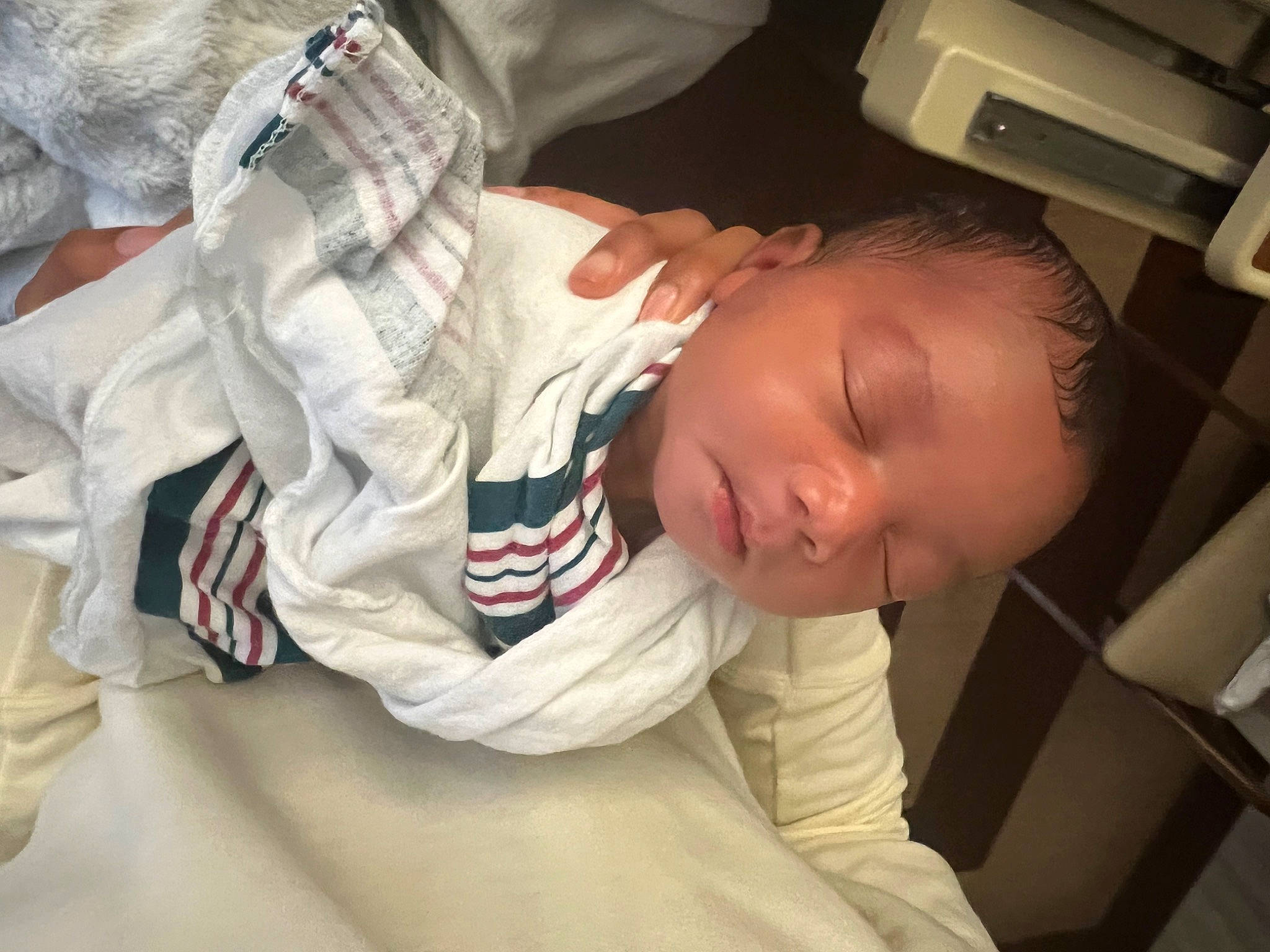 Princeton is registered to the contest to win money with this photo: baby, baby_products, baby_toddler_clothing, carmine, cheek, child, comfort, elbow, finger, flooring, leg, linens, mouth, nose, person, room, sitting, sleep, sleeve, t_shirt