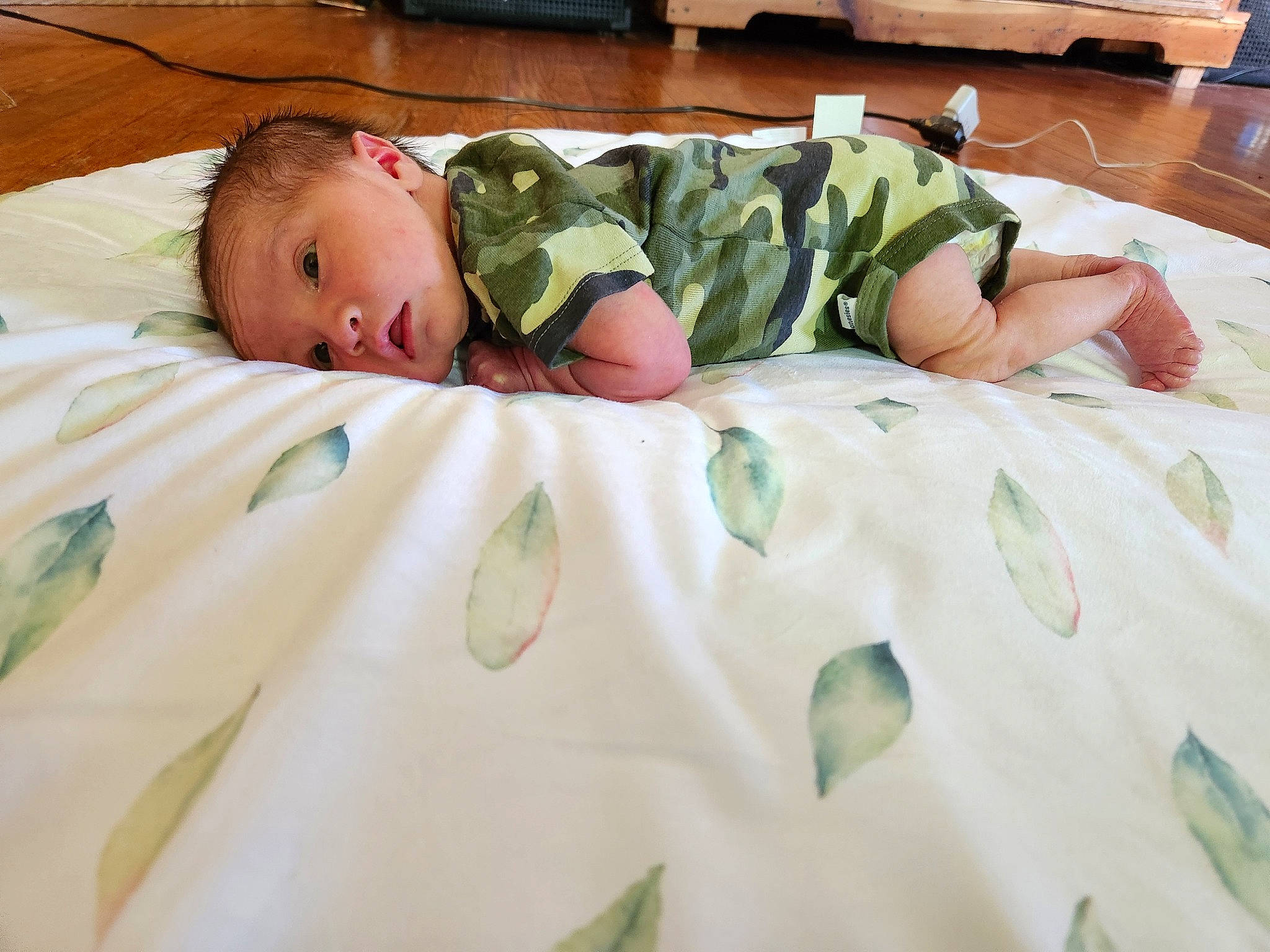 Thomas joined the competition — help win amazing prizes! baby, baby_products, baby_toddler_clothing, bed, bed_sheet, bedding, bedroom, bedtime, blanket, child, comfort, flooring, grass, linens, military_camouflage, pattern, person, room, textile, toddler