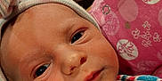 Serenity is registered to the contest to win money with this photo: newborn, baby, infant, face, hat, blanket, hospital, bed, person, closeup, skin, eyes, wrapping, pink, blue, striped, headwear, cute, young, indoors