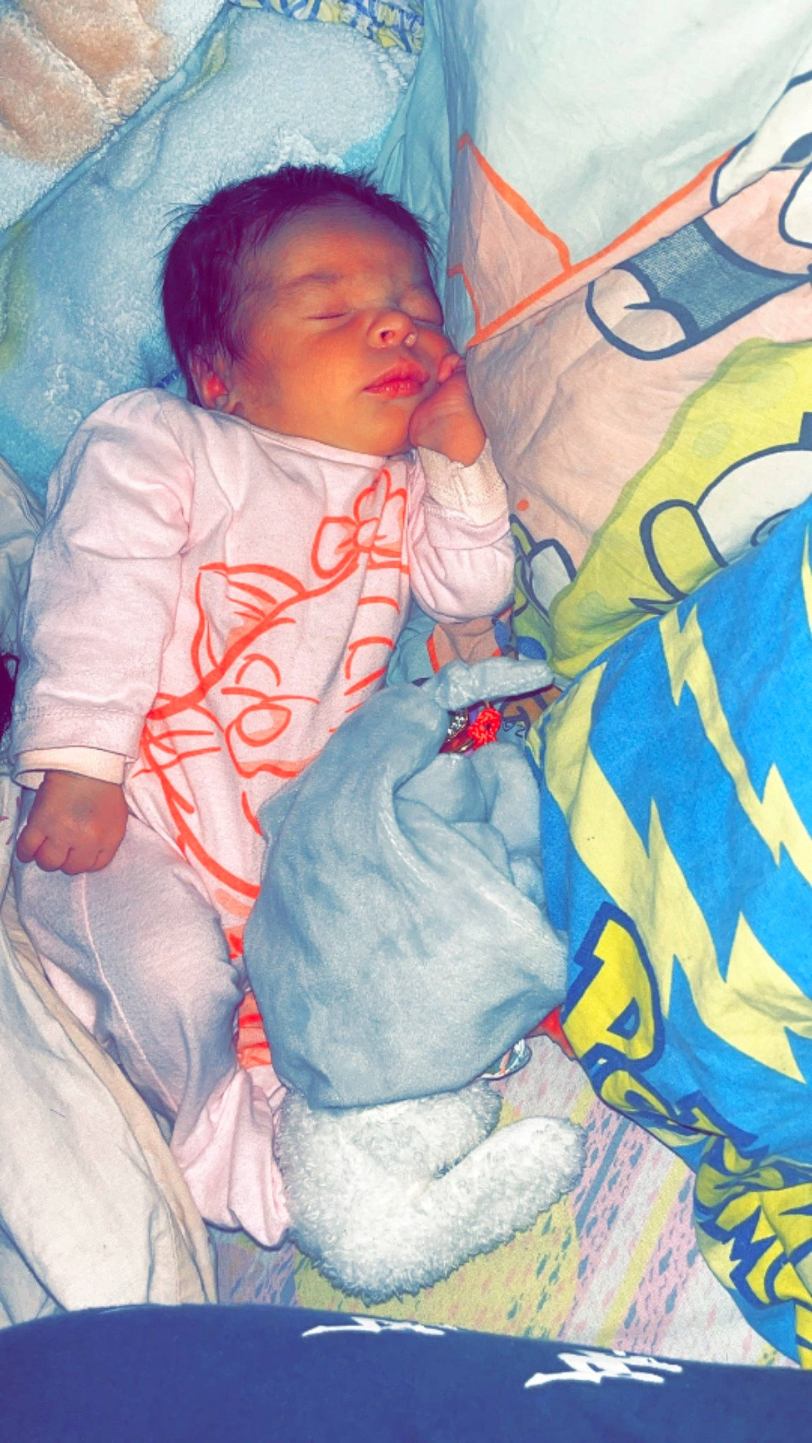 Mëlya a rejoint le concours — aidez-le/la à gagner de superbes lots ! baby, baby_products, baby_toddler_clothing, chair, cheek, child, comfort, electric_blue, event, fun, lap, linens, pattern, person, room, sitting, sleeve, toddler, winter