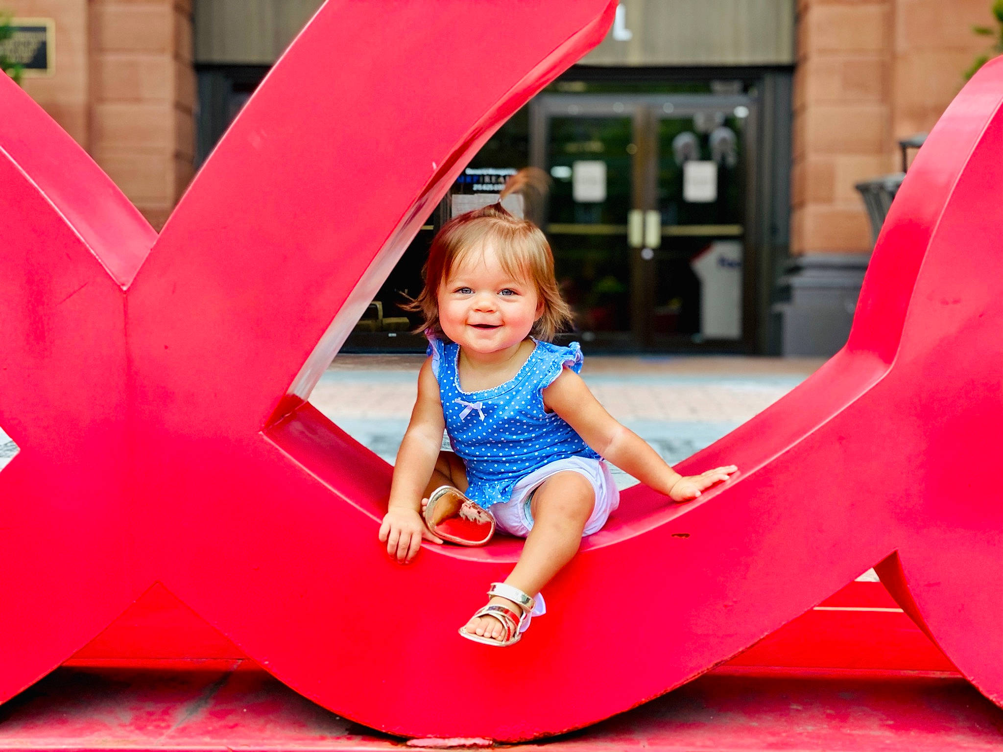 Laci joined the competition — help win amazing prizes! child, fun, games, human_settlement, joy, leisure, outdoor_play_equipment, person, pink, play, playground, public_space, recreation, red, sitting, smile, toddler