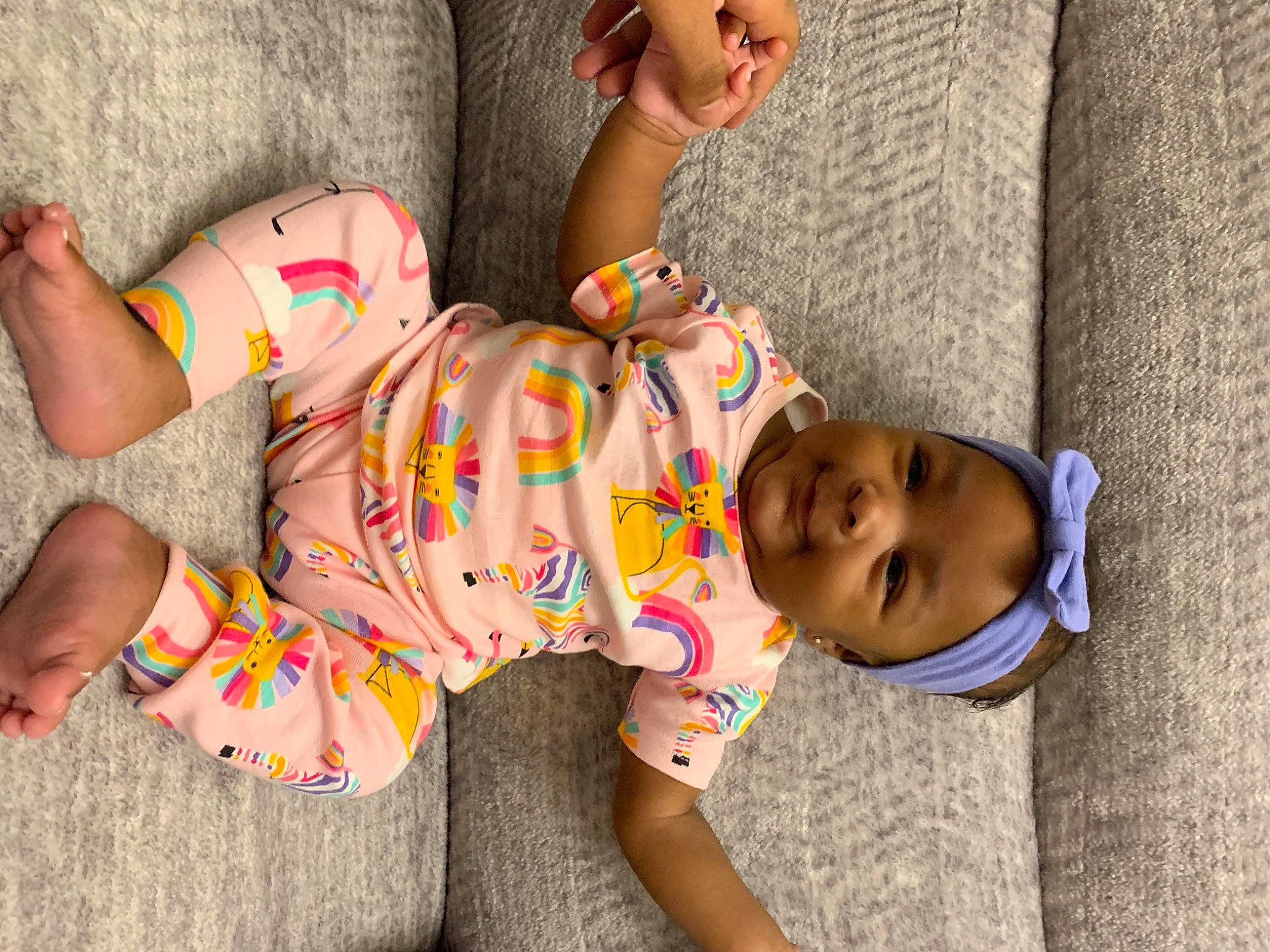 Leasia is registered to the contest to win money with this photo: baby, baby_toddler_clothing, barefoot, child, comfort, face, flooring, foot, happy, headwear, human_body, human_leg, joint, leg, mouth, nail, pattern, person, sandal, skin
