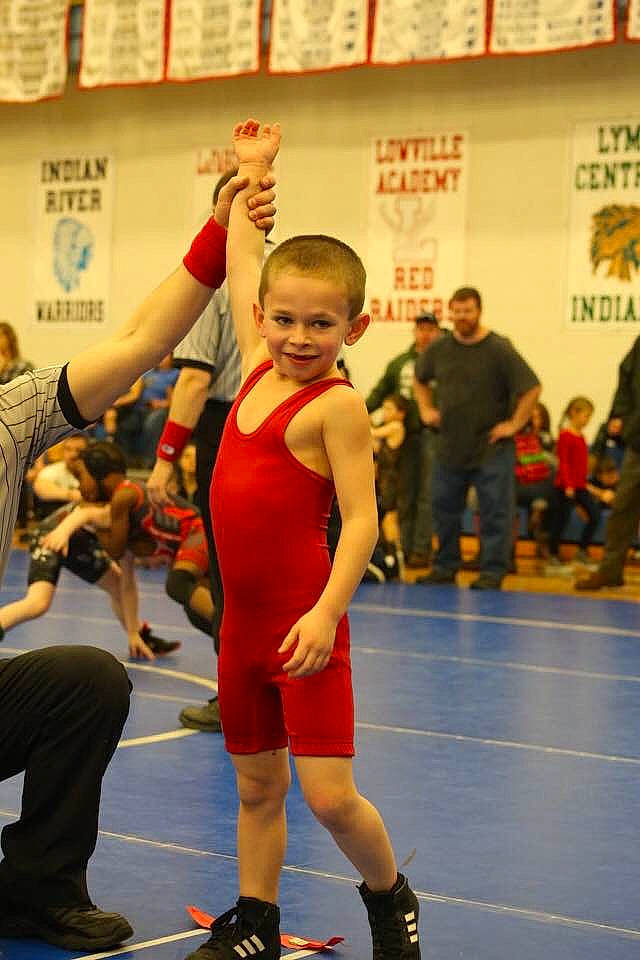 Connor is registered to the contest to win money with this photo: blurred, championship, collegiate_wrestling, combat_sport, competition_event, contact_sport, entertainment, folk_wrestling, grappling, joy, person, player, shoe, shorts, smile, sneakers, sports, sports_uniform, sportswear, tournament