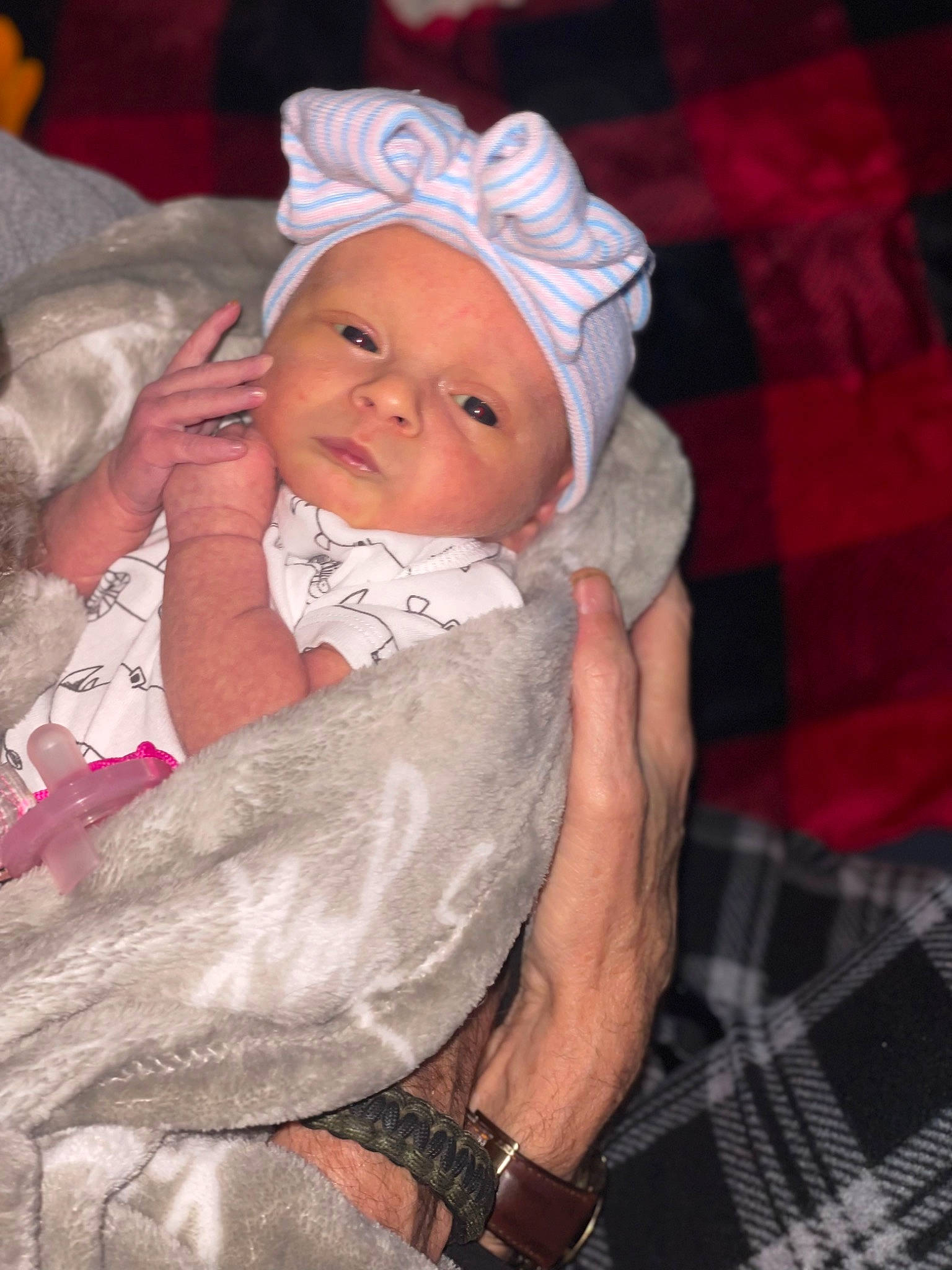 Mckenna is registered to the contest to win money with this photo: baby, baby_products, baby_toddler_clothing, cheek, child, comfort, event, happy, hat, headwear, linens, nail, pattern, person, plaid, room, sitting, tartan, toddler, tradition