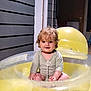 accessories, architecture, baby, face, happy, head, outdoorplayarea, outdoors, person, photography, plant, playarea, pool, portrait, pottedplant, sitting, slide, summer, toy, water
