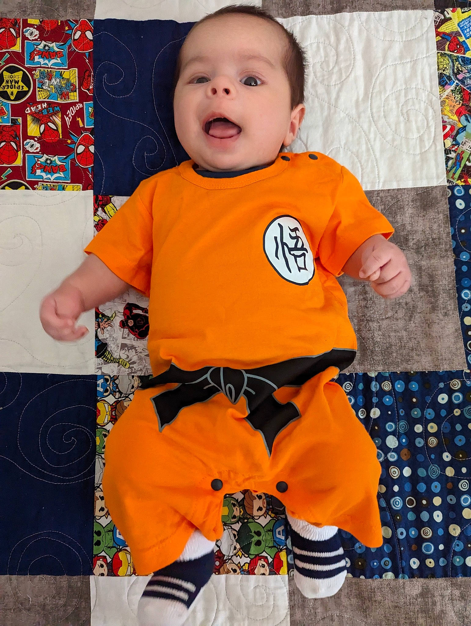 Reiner joined the competition — help win amazing prizes! baby, baby_toddler_clothing, child, eye, face, flooring, happy, head, linens, orange, pattern, person, photograph, play, product, skin, sleeve, smile, t_shirt, toddler