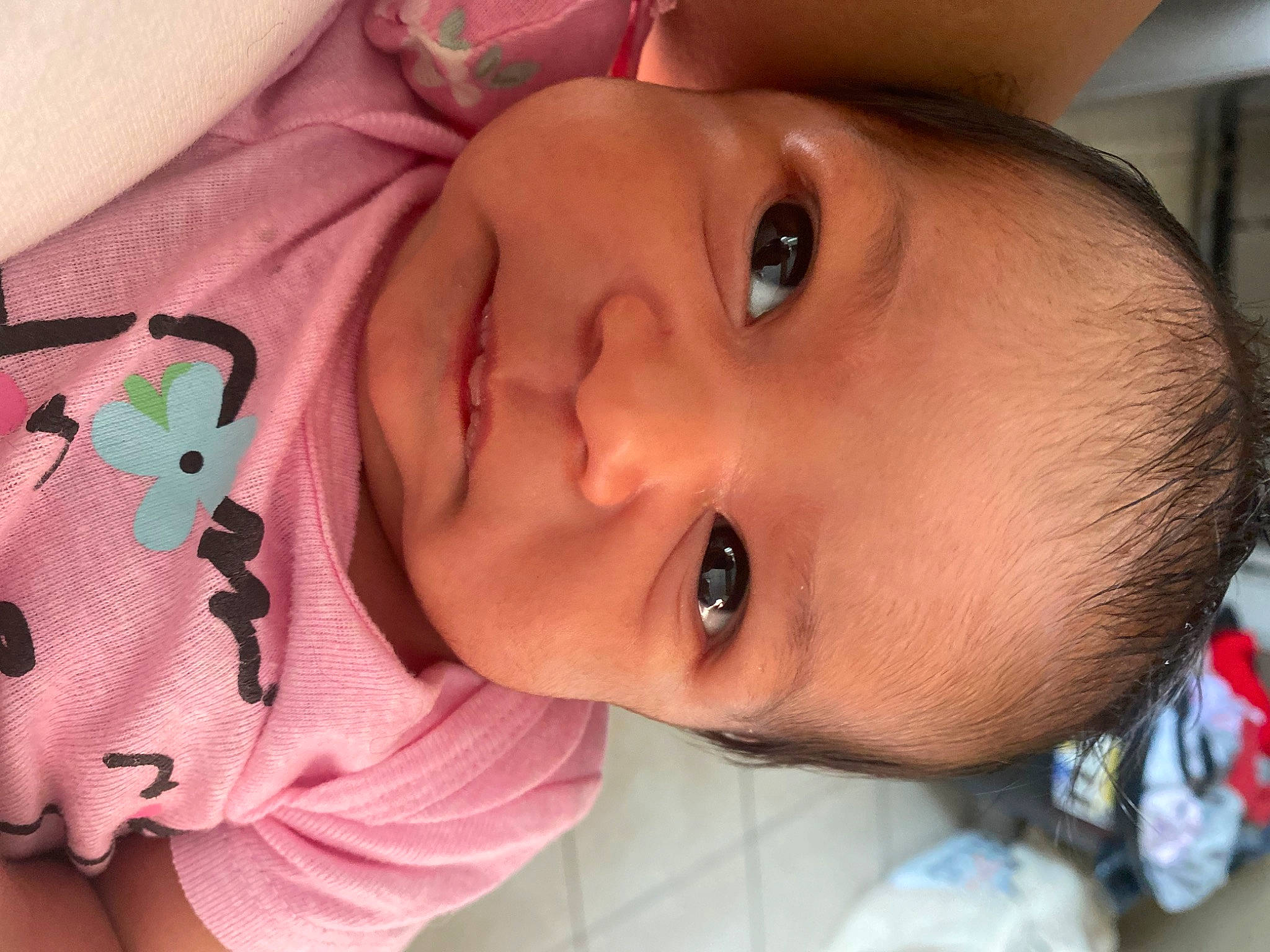 Olivia is registered to the contest to win money with this photo: baby, cheek, chin, clothing, ear, eye, eyebrow, eyelash, face, facial_expression, forehead, head, human_body, lip, mouth, neck, nose, organ, person, skin