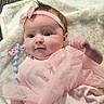 baby, infant, pink_dress, headband, blanket, pacifier_clip, clothing, cute, child, portrait, lying_down, soft_toys, indoors, person, newborn, adorable, happy, small_hand, face, young