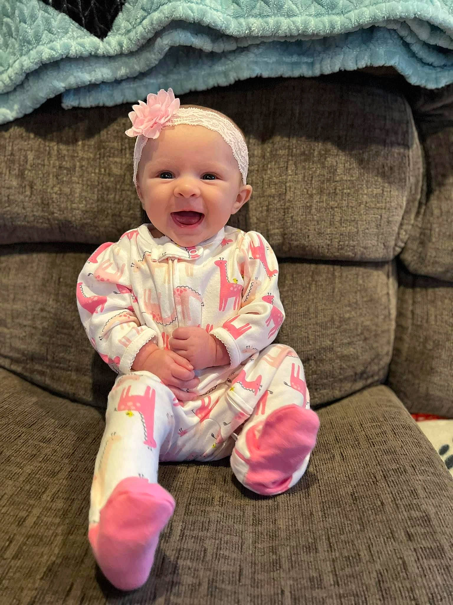 Paisley Rae is registered to the contest to win money with this photo: baby, baby_laughing, baby_toddler_clothing, cheek, chin, comfort, eye, face, grass, happy, head, human_body, lip, nose, person, pink, sitting, skin, sleeve, smile