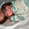 Ario joined the competition — help win amazing prizes! newborn, baby, infant, adult, sleeping, resting, hospital, bed, blanket, swaddled, onesie, portrait, family, parent, snuggling, peaceful, indoors, close_up, face, tired