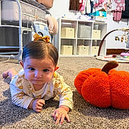 Julietta joined the competition — help win amazing prizes! baby, infant, child, crawling, face, portrait, bow, hair, smiling, carpet, pumpkin, plush, nursery, baby_clothes, crib, shelf, toys, indoor, home, autumn