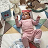 Julietta is registered to the contest to win money with this photo: baby, baby_clothes, blanket, carpet, child, comfort, cute, floor, home, indoor, infant, lying_down, mobile, nursery, pacifier, pink_pajamas, play_mat, soft_toys, teddy_bear, toy