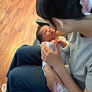 Julietta joined the competition — help win amazing prizes! baby, blanket, care, casual, clothing, expression, face, flooring, hand, holding, indoor, infant, love, mom, newborn, person, scrunchie, seated, woman, wood_floor