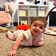 Julietta joined the competition — help win amazing prizes! baby, child, infant, smiling, crawling, floor, carpet, playroom, indoors, portrait, face, eyes, hands, clothing, dress, toys, stuffed_animal, shelves, wardrobe, nursery