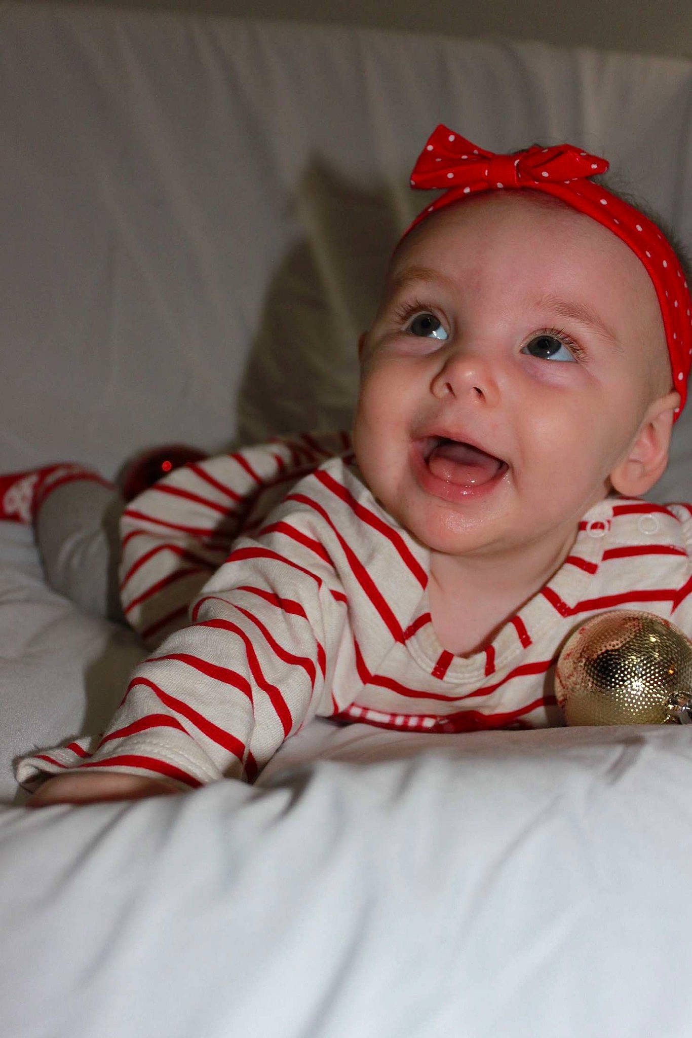 Claudia is registered to the contest to win money with this photo: baby, cheek, child, head, headgear, person, red, skin, smile, toddler