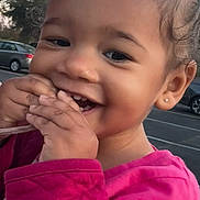 Aniyah joined the competition — help win amazing prizes! child, toddler, smiling, happy, curly_hair, pink_jacket, outdoor, trees, car, parking_lot, face, earring, portrait, cute, hands, person, daylight, nature, emotion, joy