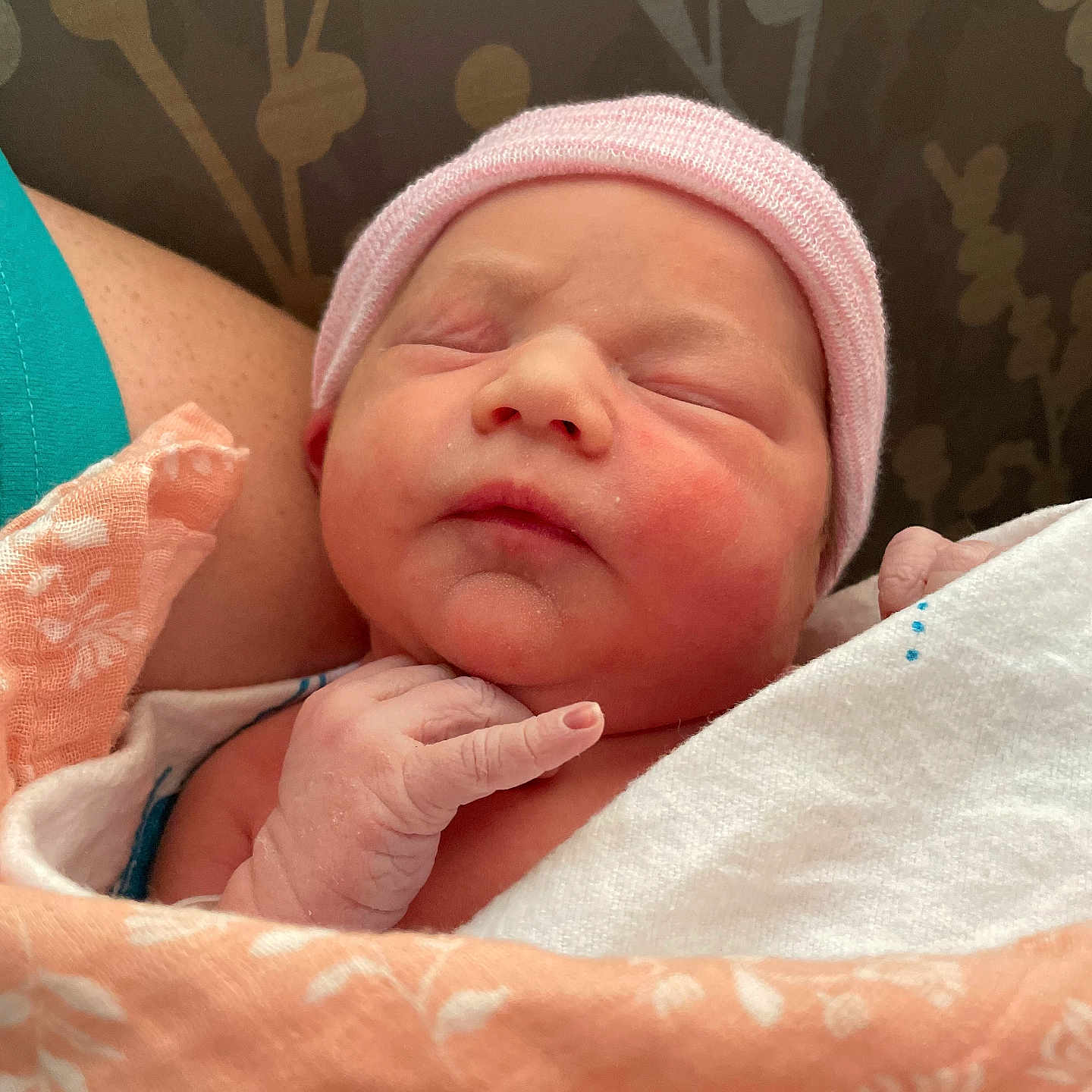 Marie is registered to the contest to win money with this photo: baby, blanket, closeup, cozy, face, hand, hat, human, indoors, infant, newborn, peaceful, person, portrait, resting, skin, sleeping, soft, warm, wrapped