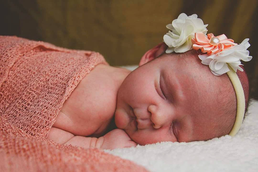 Reya joined the competition — help win amazing prizes! baby, baby_sleeping, baby_toddler_clothing, cheek, comfort, eye, flower, grass, hand, head, headband, headgear, headpiece, linens, lip, person, plant, skin, textile, toddler