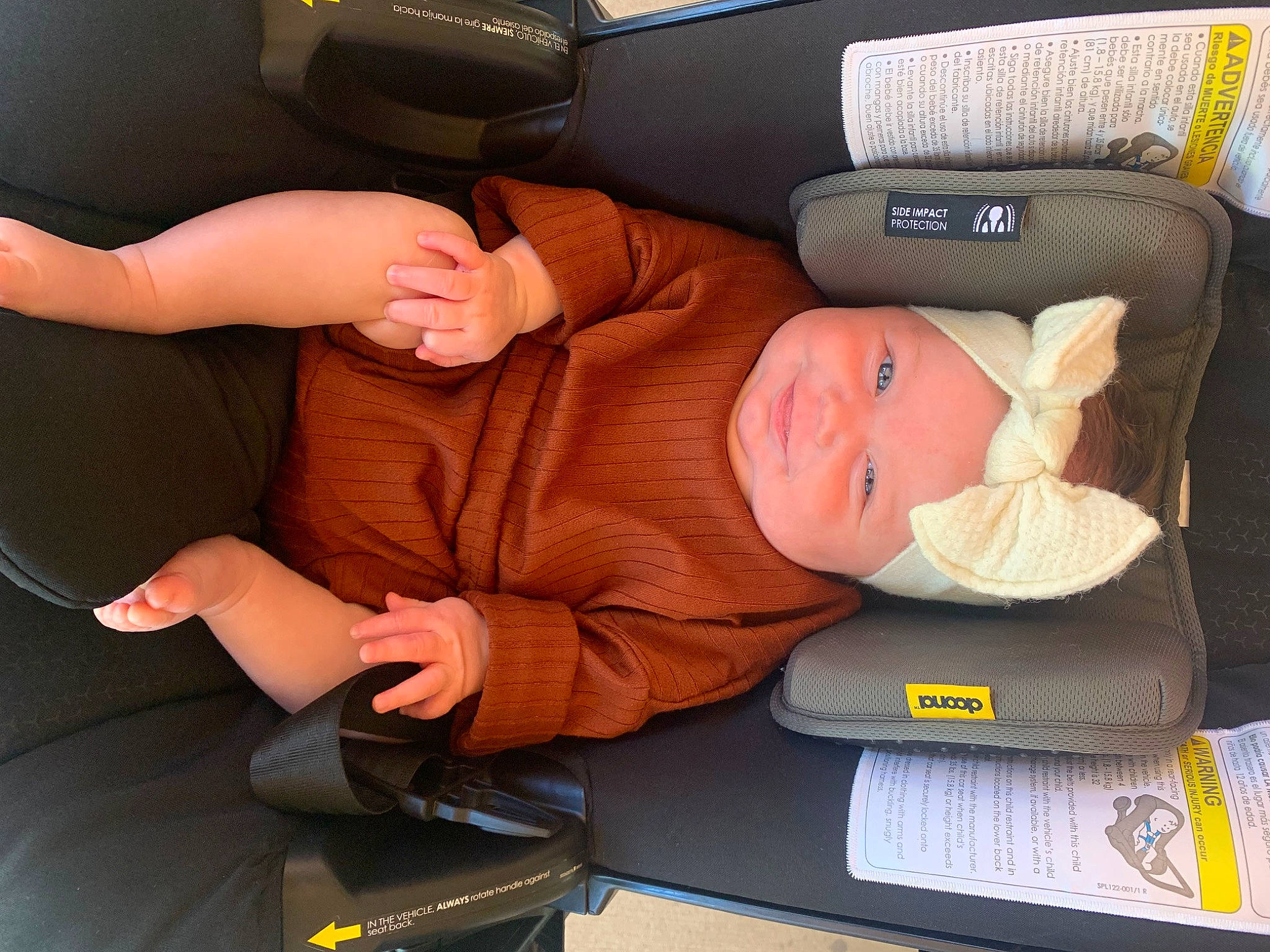 Clara Jo is registered to the contest to win money with this photo: auto_part, automotive_design, baby, baby_products, baby_toddler_clothing, car_seat, child, comfort, family_car, finger, gesture, hat, head_restraint, headwear, joy, luxury_vehicle, motor_vehicle, person, seat_belt, thumb