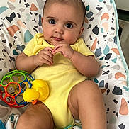 Benjamín is registered to the contest to win money with this photo: baby, big_eyes, bouncer_seat, child, closeup, colorful_ball, cute, hands, indoor, infant, legs, patterned_fabric, playtime, portrait, skin, smile, stuffed_toy, teether, toy_duck, yellow_onesie