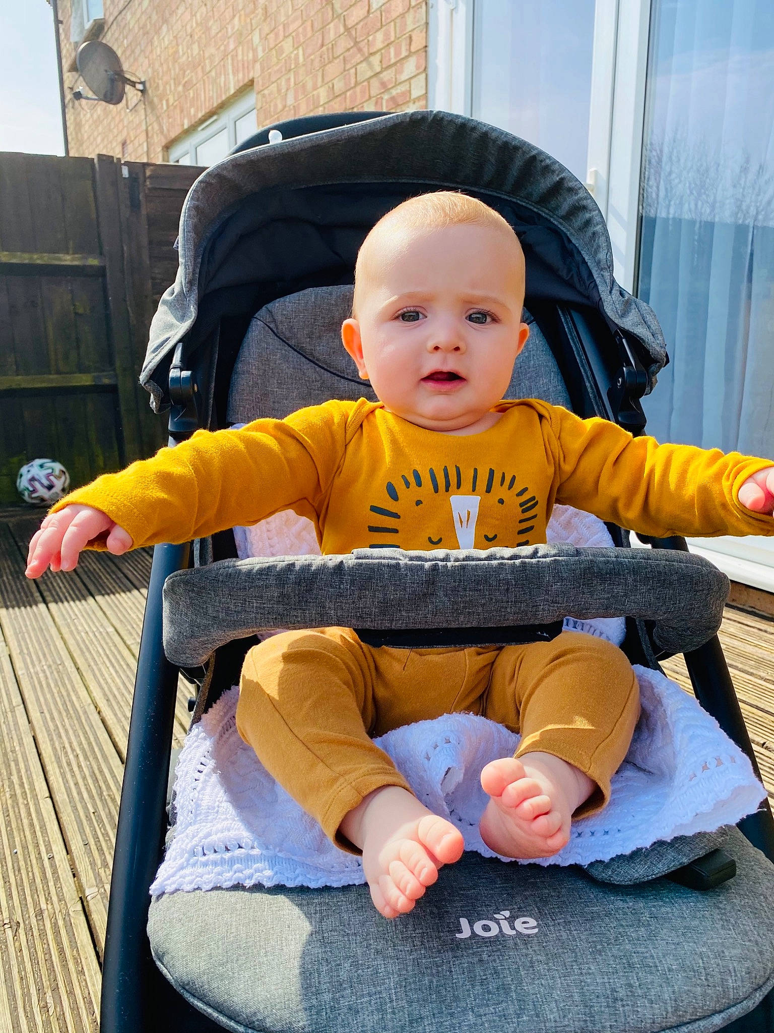 Matei is registered to the contest to win money with this photo: baby, baby_carriage, baby_products, baby_toddler_clothing, chair, child, comfort, curtain, face, fun, hairstyle, lap, leisure, person, shorts, sitting, skin, sleeve, t_shirt, toddler
