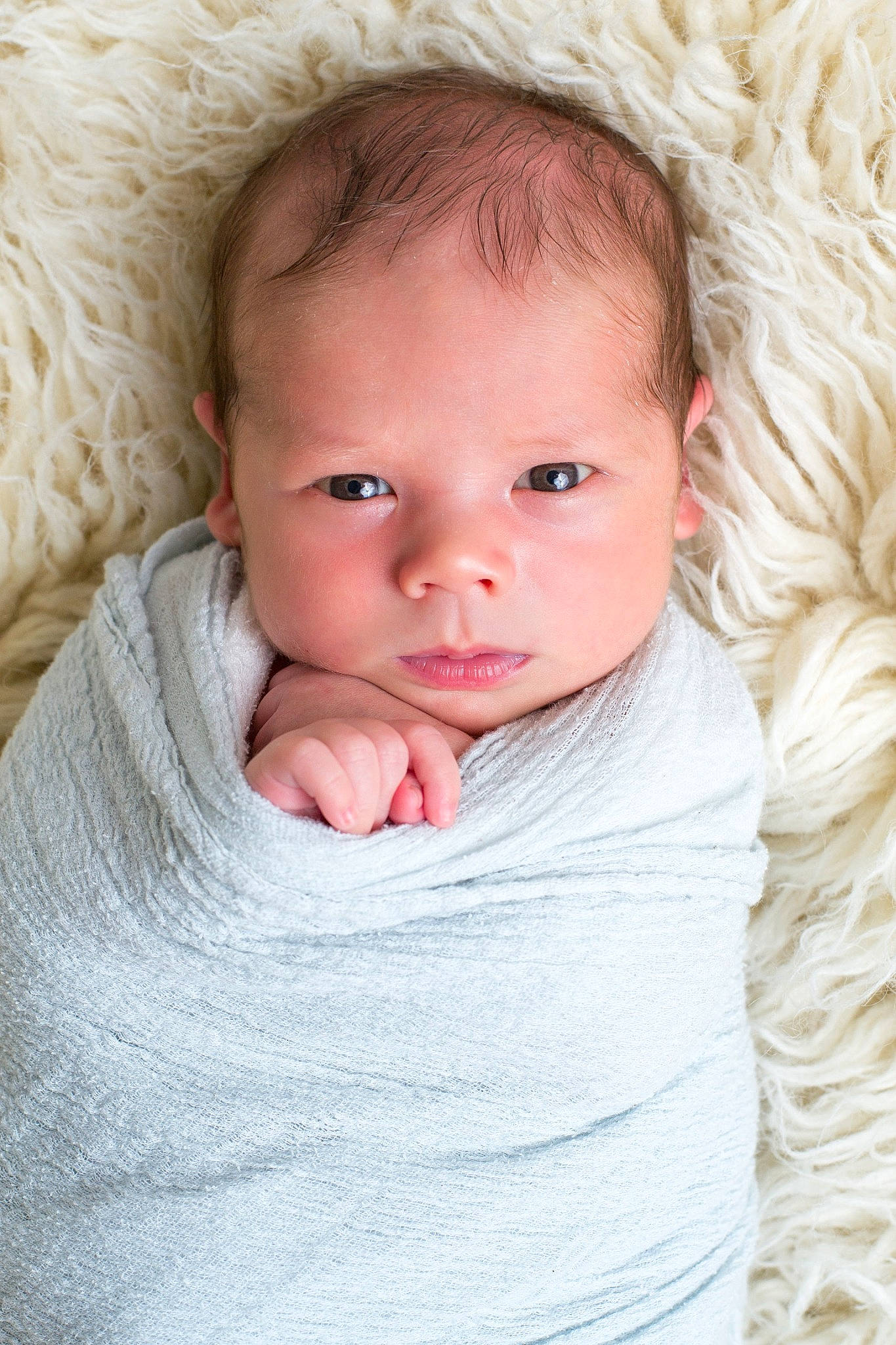 Jude is registered to the contest to win money with this photo: baby, baby_toddler_clothing, cheek, child, chin, collar, comfort, facial_expression, fur, happy, iris, linens, lip, nose, outerwear, person, product, skin, sleeve, toddler