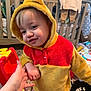 toddler, child, hoodie, yellow, red, hand, holding, baby, nursery, toys, clothing, indoor, person, cute, smiling, face, baby_furniture, carpet, hand_holding, plush