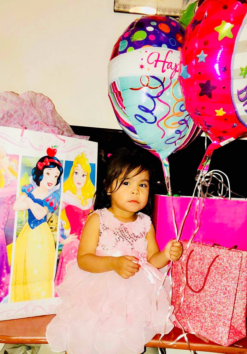 Aliyah is registered to the contest to win money with this photo: balloon, birthday, birthday_party, event, happy, party, party_supply, person, pink