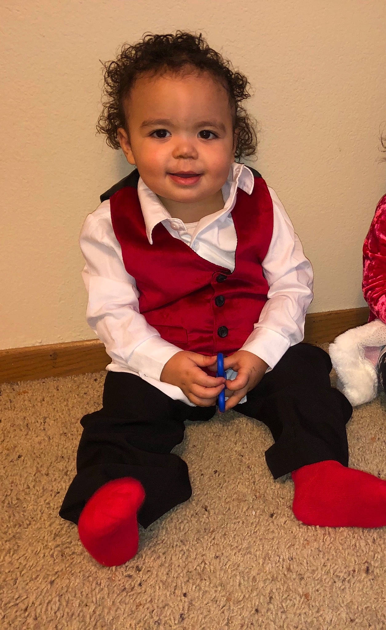 Major is registered to the contest to win money with this photo: arm, baby, child, christmas, leg, outerwear, person, play, sitting, smile, standing, toddler