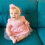 Irina is registered to the contest to win money with this photo: accessories, baby, chair, clothing, couch, cushion, dress, face, furniture, happy, hat, head, headband, homedecor, pants, person, photography, portrait, sitting, smile