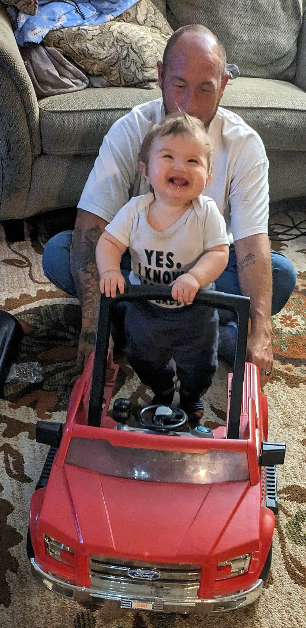 Alexander is registered to the contest to win money with this photo: auto_part, automotive_exterior, automotive_tire, automotive_wheel_system, baby, baby_carriage, baby_products, bumper, child, face, hood, motor_vehicle, person, photograph, shorts, smile, tire, toddler, vehicle, wheel