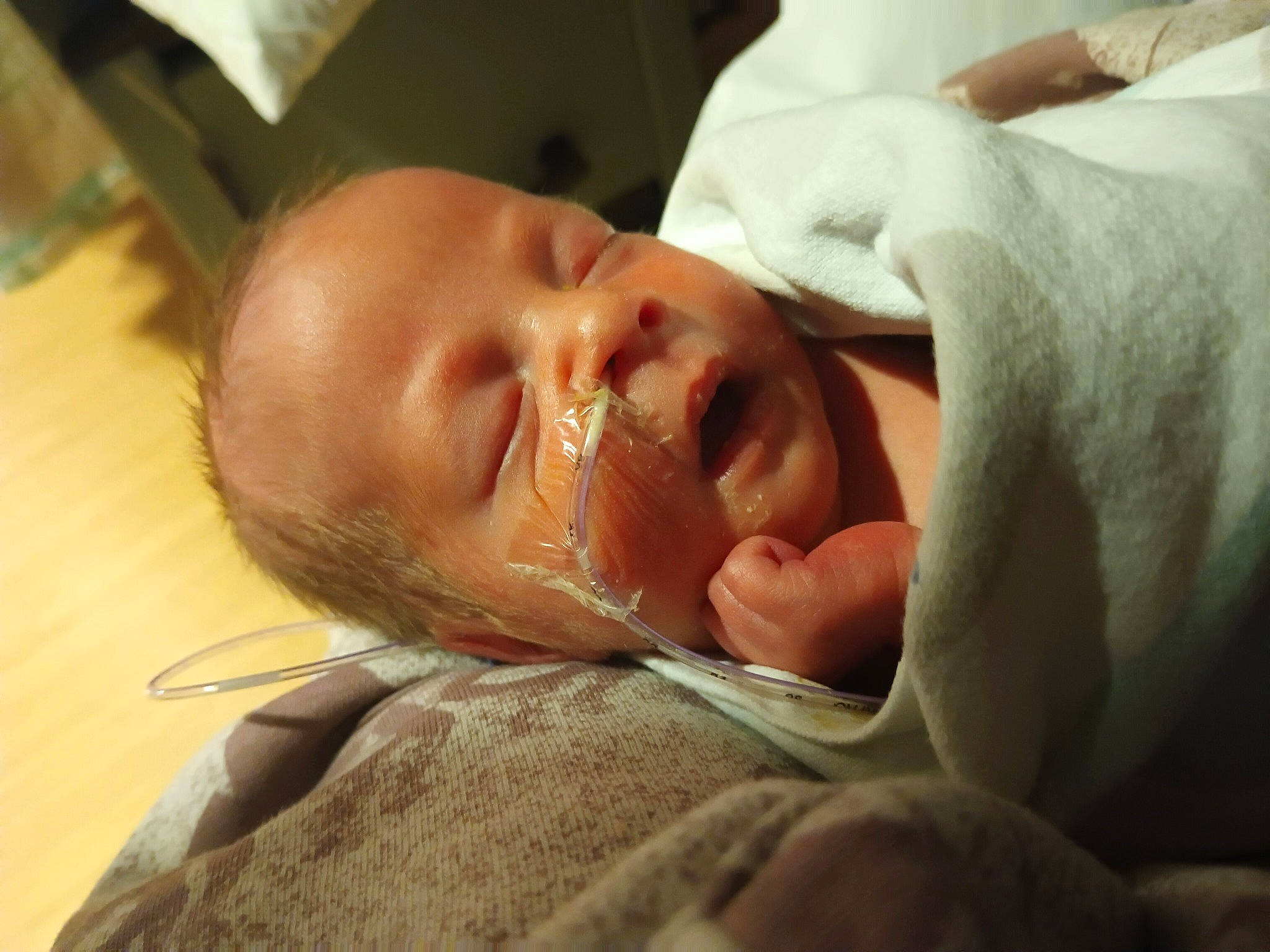 Peyton is registered to the contest to win money with this photo: baby, cheek, child, childbirth, comfort, ear, event, eyelash, gesture, happy, hat, nose, person, room, smile, thumb, toddler, wrinkle