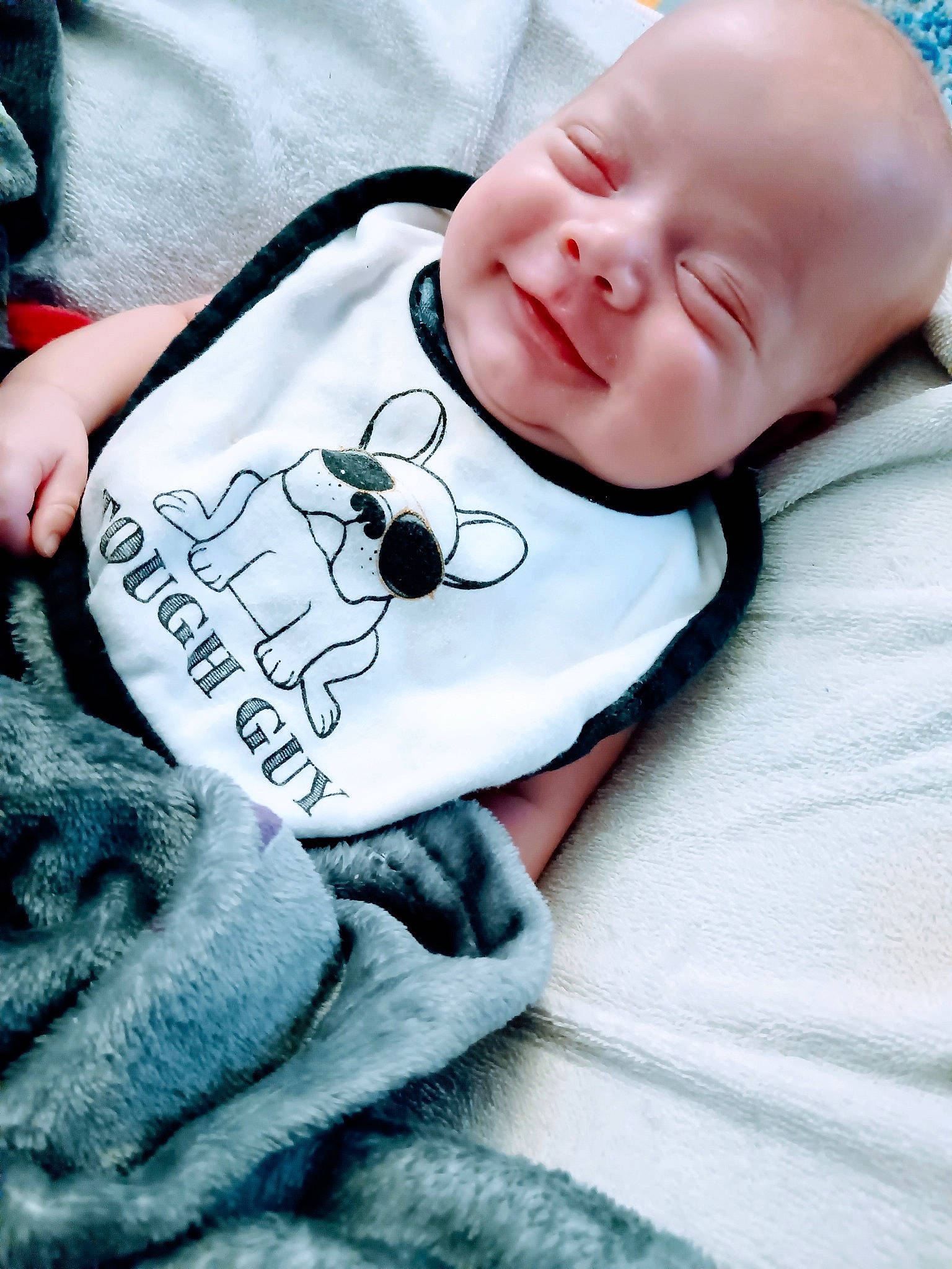 Abel joined the competition — help win amazing prizes! baby, baby_products, baby_sleeping, baby_toddler_clothing, cheek, child, comfort, font, happy, linens, pattern, person, portrait_photography, sitting, sleeve, smile, t_shirt, textile, toddler, white