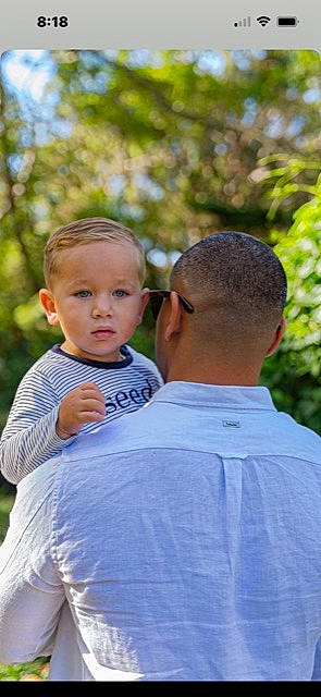 Hunter joined the competition — help win amazing prizes! baby, child, electric_blue, event, family, fun, gesture, grass, happy, leisure, love, people_in_nature, person, plant, recreation, shirt, shoulder, sitting, t_shirt, toddler