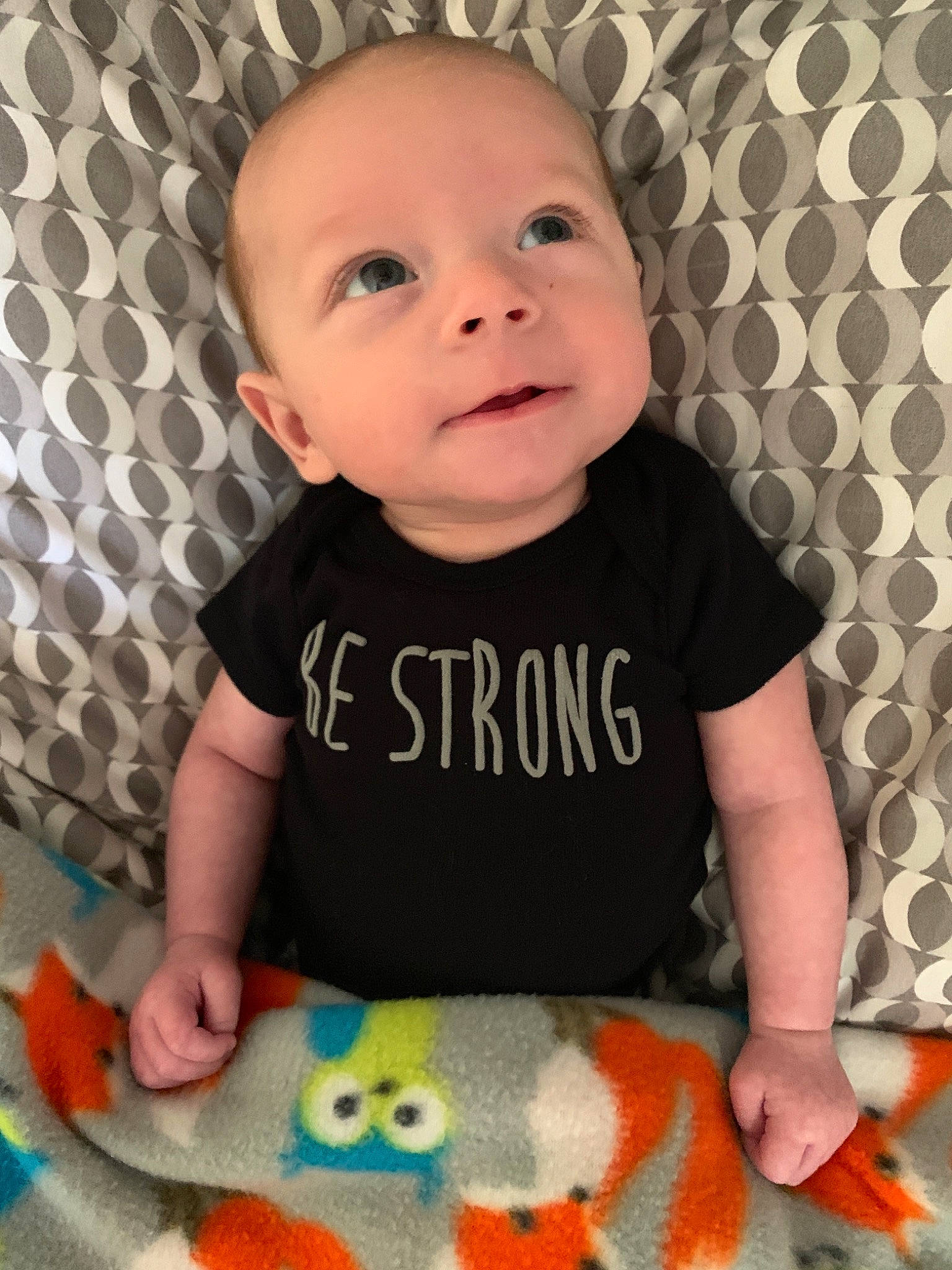 Evander is registered to the contest to win money with this photo: baby, baby_products, baby_toddler_clothing, baby_toys, cheek, child, eye, face, head, lip, nose, person, play, product, skin, sleeve, t_shirt, toddler, tummy_time