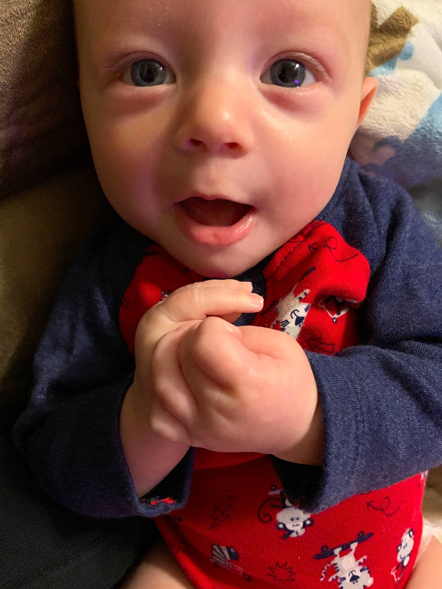 Evander joined the competition — help win amazing prizes! baby, carmine, cheek, child, chin, eye, face, finger, head, lip, mouth, nose, outerwear, person, red, skin, smile, thumb, toddler, tooth