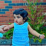 Avinaaz joined the competition — help win amazing prizes! black_shoes, blue_clothing, bracelet, brick_wall, child, crocheted_top, curious, earrings, garden, greenery, holding_hand, outdoor, pavement, person, plant, purple_socks, shorts, standing, toddler, young_child