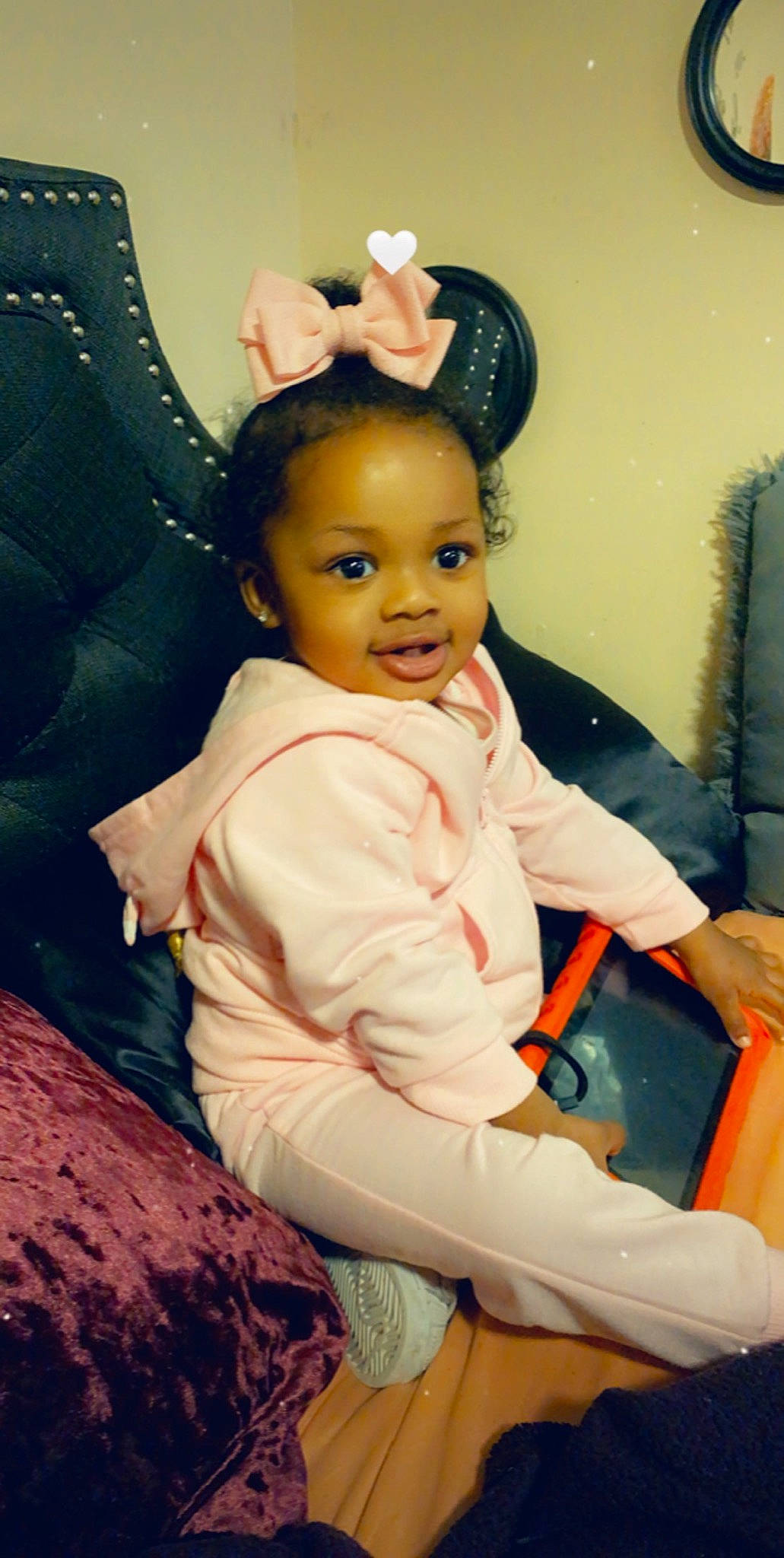 Essence is registered to the contest to win money with this photo: baby_toddler_clothing, chair, cheek, child, comfort, ear, eye, eyelash, fun, hairstyle, happy, headpiece, iris, lap, person, room, sitting, skin, smile, toddler