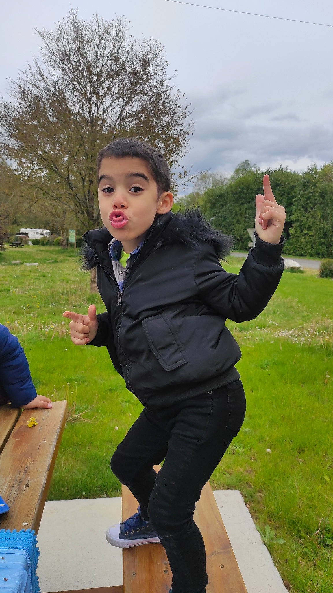 Jonathan participe au concours pour gagner de l'argent avec cette photo : blazer, child, formal_wear, fun, gesture, grass, grassland, happy, jacket, leisure, people_in_nature, person, plant, recreation, sitting, sky, sleeve, soil, suit, tree