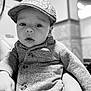 Liam participe au concours pour gagner de l'argent avec cette photo : baby, child, face, hat, cap, knitwear, jacket, portrait, indoor, person, cute, young, hand, fashion, infant, monochrome, black_and_white, closeup, expression, human